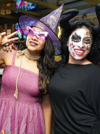 Posing with a friend in our Halloween costumes. Our themed parties are a great excuse to dress up and have some fun off the dance floor too.