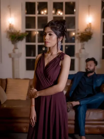 A sophisticated and moody pre-wedding shot. The makeup is elegant and refined, with a focus on her eyes.