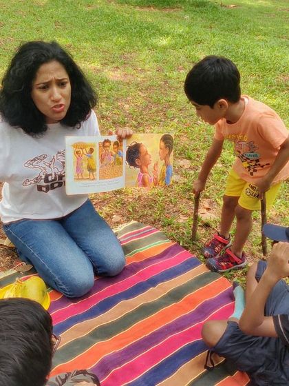 A fantastic series from our reading of 'Handa's Surprise'. My animated storytelling style is on full display, as are the delighted and curious faces of the children.