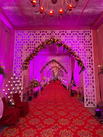 An angled view of the lattice archway entrance, showcasing the intricate details of the custom-built panels.