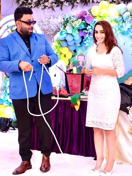 Performing a classic rope cutting illusion for an engaged audience member. This interactive trick is perfect for breaking the ice at any party.