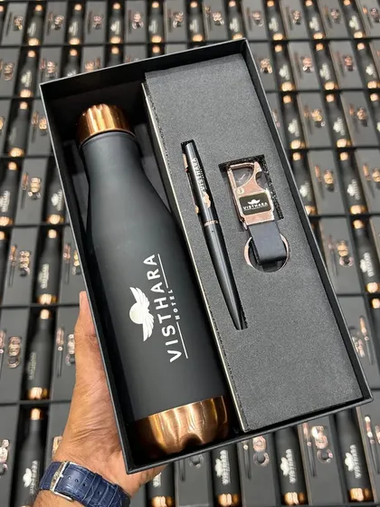 I handle large bulk orders for major brands like Visthara Hotels. This executive gift set features a matte black and rose gold temperature bottle, a matching pen, and a custom keychain, all elegantly boxed and ready for distribution.