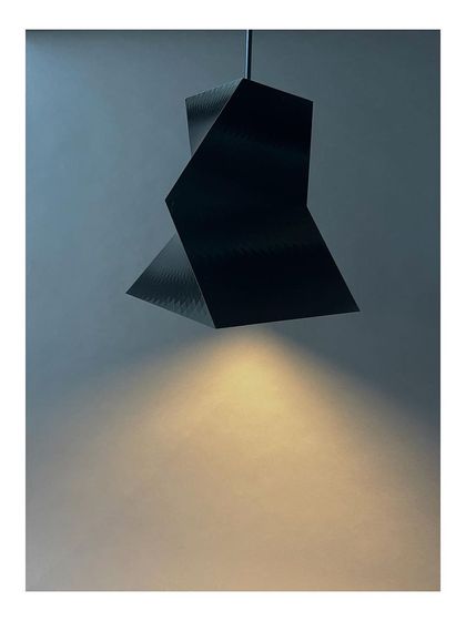 'Shifting Squares', a series of pendant lamps we designed and 3D-fabricated in our own MakerSpace. This exploration in digital fabrication and geometry demonstrates our hands-on approach to creating custom design elements for our projects.