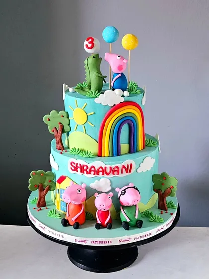 Bringing the world of Peppa Pig to life, this two-tiered cake is perfect for a child's birthday party. I hand-sculpted all the characters, including Peppa, George, and their friends, and set them in a cheerful scene with a bright rainbow and their iconic house. It’s a fun and vibrant cake that kids instantly recognize and love.