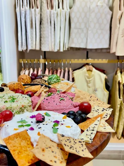 A vibrant mezze platter, featuring beetroot hummus and labneh, served at the launch of Tasva Fashion.