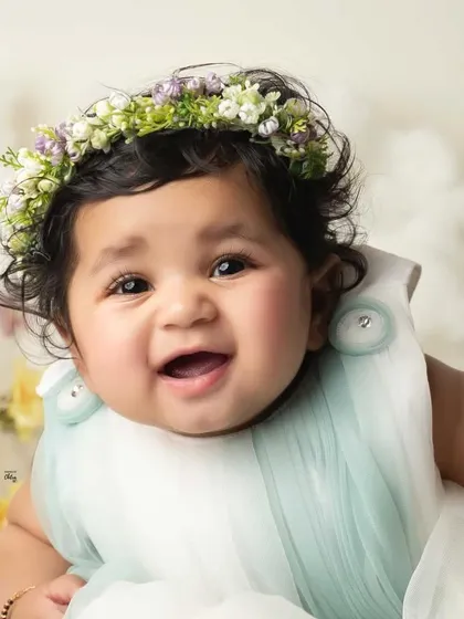 The perfect gummy grin. This close-up captures the pure happiness of a six-month-old, a precious memory from her milestone session.