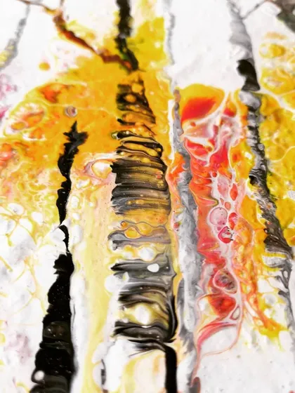 A close-up of the "Autumn" painting, showing the texture and layering. The yellow and red leaves are created by the underlying fluid pour, while the black trunks are painted on top.