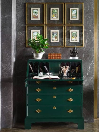 A vintage 'Queen of Vintage' Secrétaire gets a vibrant makeover with a mosque green lacquer finish. Adorned with a collection of old ivory Indian miniature paintings, it's a perfect example of how we love to breathe new life into classic pieces.