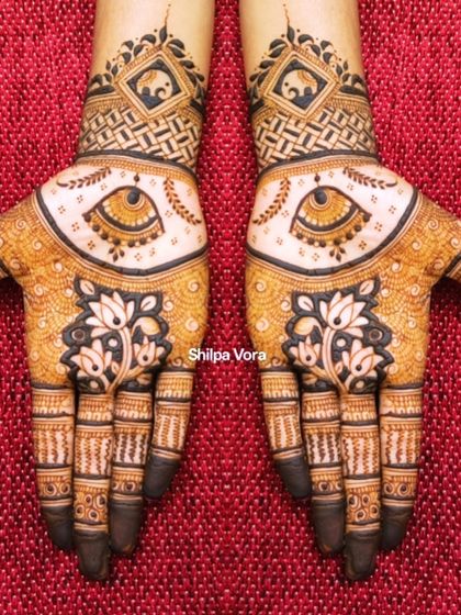 A unique design with an 'evil eye' motif for protection, combined with traditional lotus and elephant elements.