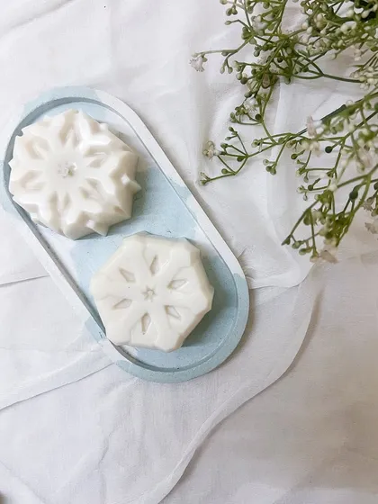 One of our top sellers this Christmas season: the snowflake candle. It looks beautiful on our marbled trinket trays.