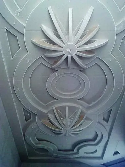 An incredibly detailed POP ceiling with multiple floral and geometric motifs, demonstrating master-level craftsmanship.