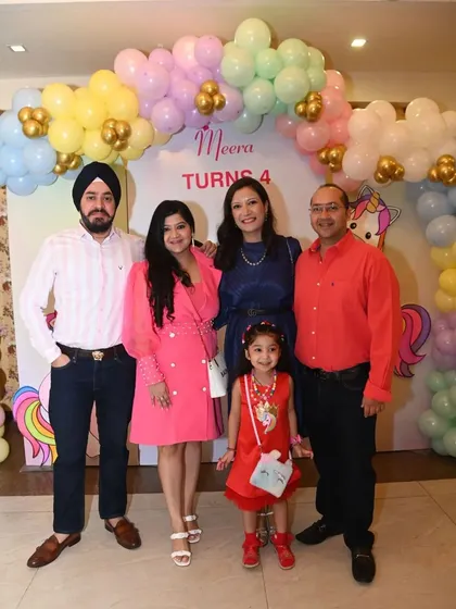 Guests enjoying the unicorn-themed photo backdrop. Our setups are designed to be the perfect spot for capturing happy memories.