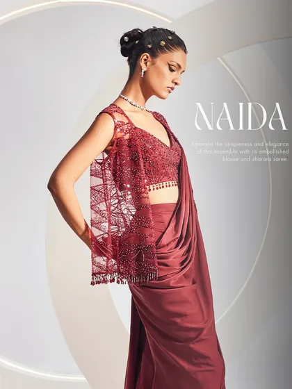 A close-up of the NAIDA Sharara Saree Set, focusing on the heavily embellished jacket and the unique sharara-saree drape.