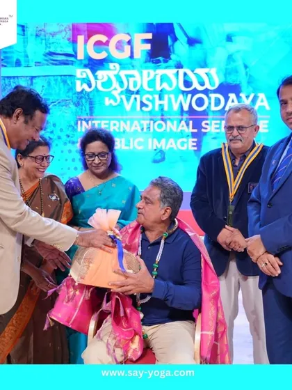 Receiving the award for my work in promoting yoga internationally. I am grateful for this incredible recognition.