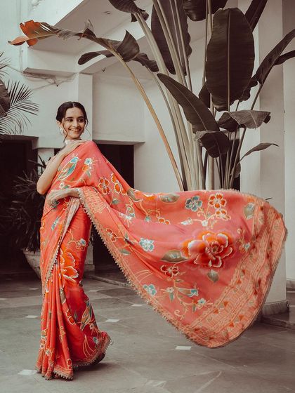 Capturing the beautiful flow of a saree is one of my favorite things to do. This shot shows the full expanse of the printed pallu, creating a sense of grace and movement.