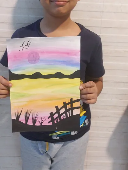 A beautiful sunset landscape painted by one of my students. We learn about blending colors to create different moods and effects.