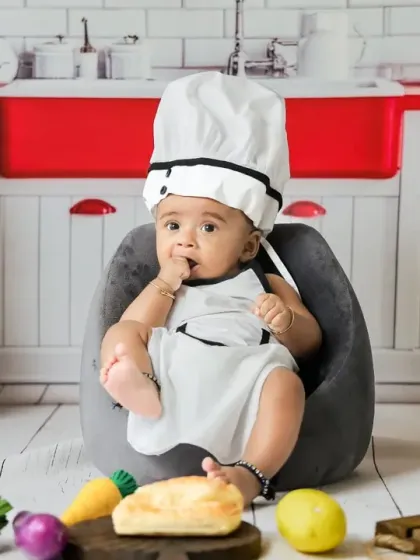 Our little master chef is taking a break. The miniature kitchen setup is filled with fun details and props for an interactive photoshoot.