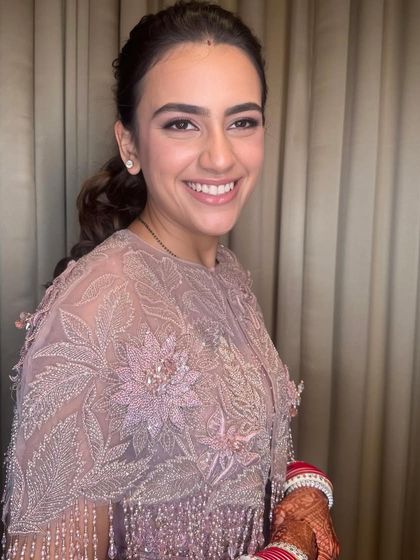 A smiling portrait that shows off her radiant skin and happy glow.