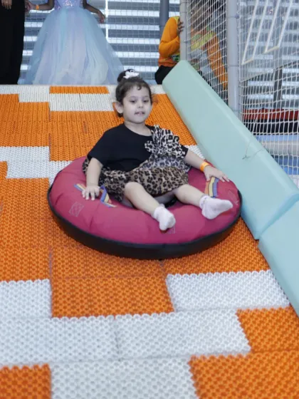 Another happy slider on our doughnut tube slide, a favorite attraction for kids seeking a fun and gentle thrill.