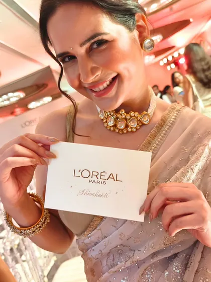 The joy on a guest's face is why I love what I do. This moment was captured at a L'Oréal Paris Diwali party, where I created personalized handwritten cards, making each guest feel truly special and seen.
