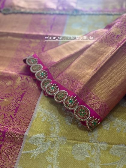 The sleeve cuff of the pink blouse, showing a continuous line of the motifs.