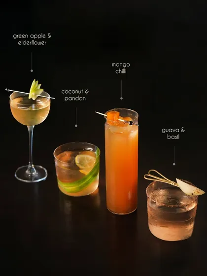 Our cocktail menu offers a journey through four distinct moods. This collection features diverse flavor profiles, from the crisp Green Apple & Elderflower to the spicy Mango Chilli, the tropical Coconut & Pandan, and the herbaceous Guava & Basil, showcasing our creative range.