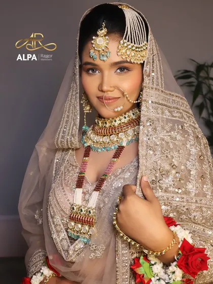 A candid shot that shows the bride's happiness. The makeup is designed to be photogenic and beautiful from every angle.