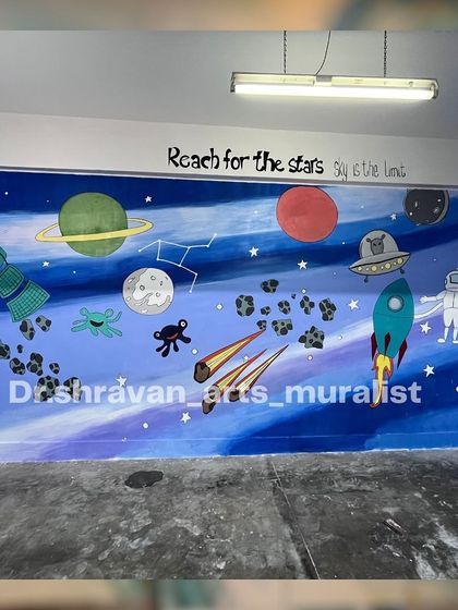 When she asks for space, I paint the entire galaxy! This space-themed mural is filled with planets, asteroids, rockets, and a friendly astronaut, with the inspiring quote "Reach for the stars."