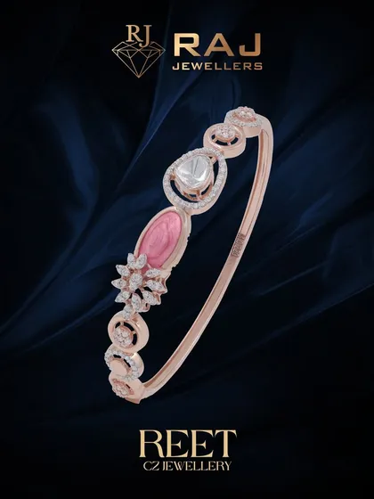 A delicate and feminine bracelet featuring soft pink and white stones in an elegant, flowing design. This piece is perfect for adding a touch of romantic color to your wrist.