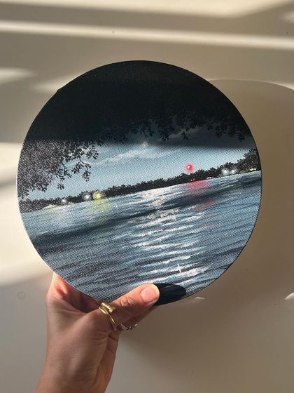 The round nightscape painting in the sunlight, showing the texture and details.