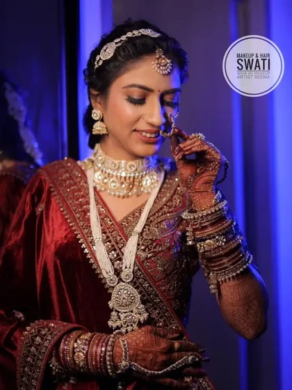 A close-up of Priya's bridal look, showing off her beautiful white jewellery set and the traditional nath.