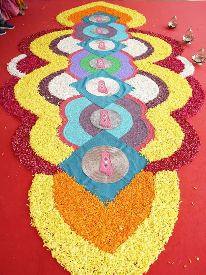 We honor cultural traditions with beautiful, custom designs like this Saptapadi floral arrangement on the floor. Using colorful flower petals, we create intricate patterns that are central to the South Indian wedding ceremony.