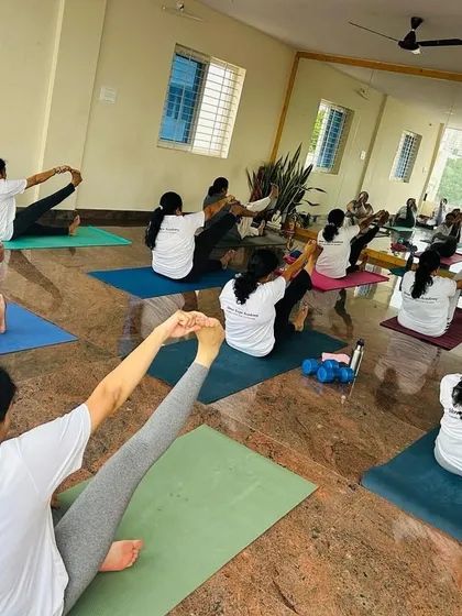 This photo captures the spirit of my classes perfectly. It’s not about being flexible, it’s about being willing to show up for yourself. Here you see students of all levels working on a seated forward bend, each on their own unique journey.