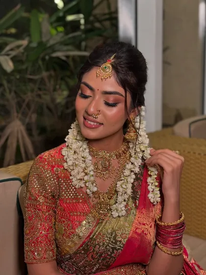 A close-up of the soft, glowing makeup, with shimmery eyelids and perfectly defined features.