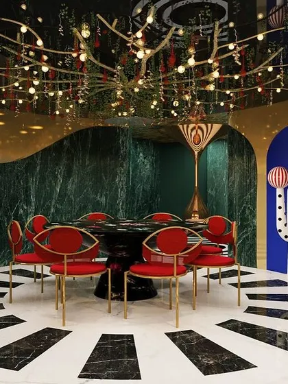 We believe design should also be fun. This dramatic dining space from our "Whimsy Wonder" project showcases our love for maximalism, with a theatrical chandelier, bold colors, and quirky art creating an unforgettable, immersive experience.