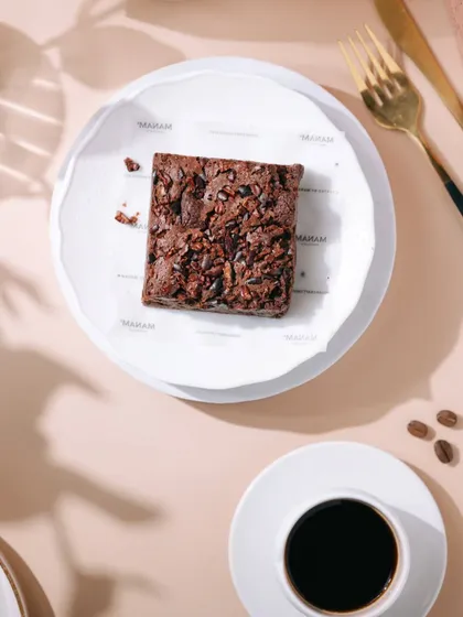 Another angle of the Manam Chocolate brownie, focusing on the texture and crumbs. I take multiple shots of the same product to provide a variety of options for marketing materials.
