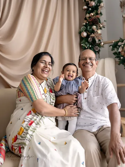 Grandparents' joy. This beautiful portrait captures the immense happiness of grandparents with their grandchild.