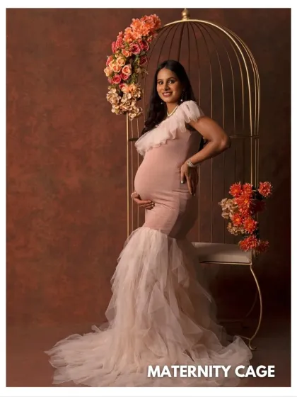 The "Maternity Cage" setup is perfect for creating dramatic and memorable portraits. This shot showcases the beautiful silhouette of the gown and the expecting mother.