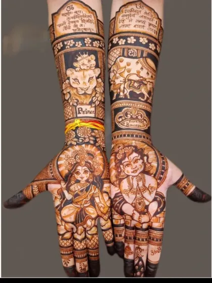 A unique baby shower mehandi with portraits of baby Krishna and Durga Maa, along with their vahanas (divine vehicles), the cow and the lion.
