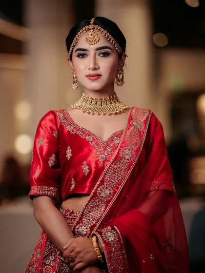 A direct portrait, showing the clean and sophisticated makeup.