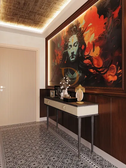 Another view of the artistic foyer, highlighting the textured ceiling panel and the way the backlit artwork commands attention.