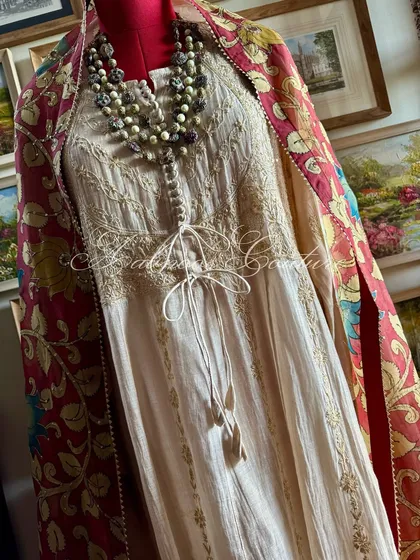 A full-length shot capturing the entire ensemble, including the flow of the Anarkali and the dramatic drape of the dupatta.