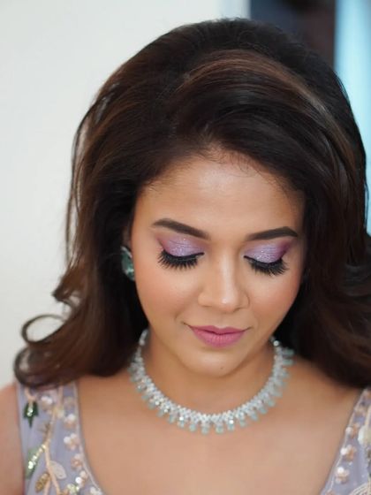 A detailed shot of the glittery lilac eyeshadow. This look is perfect for a client who wants something romantic, modern, and a little bit magical for her engagement.
