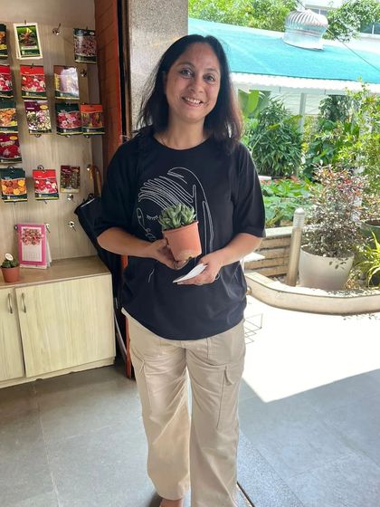 A happy visitor receives a free succulent on World Environment Day. It's our little way of saying thank you to our planet and our community.