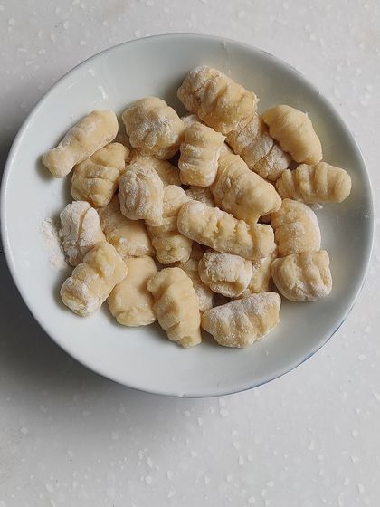 Fluffy potato gnocchi, light as pillows. Learn the secret to making perfect gnocchi that doesn't turn dense or chewy.