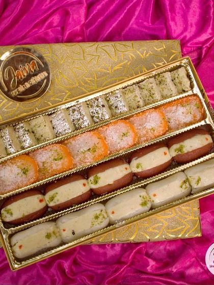 This long gift box is designed to impress, filled with our signature sweets like malai chap and various barfis. It’s a great way to share the taste of our heritage with friends and family.