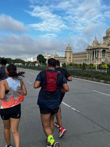 Running past the Vidhana Soudha with my teammates. There's a special kind of motivation that comes from running together through the streets of our city.