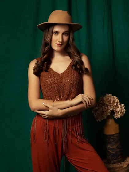 A strong, confident pose. The crossed arms and direct gaze give this shot a powerful presence.