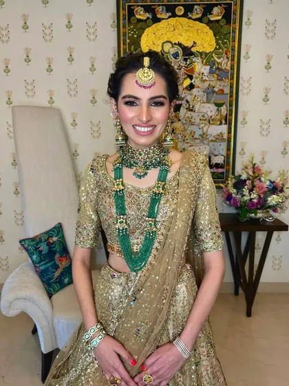 A full view of the bride, showing how the elegant braided updo balances her regal attire for a wedding ceremony.