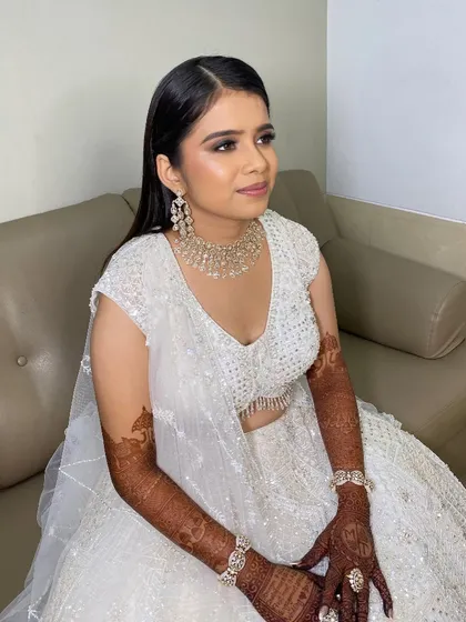 Twinkle looking stunning and ready for her Sangeet. The all-white ensemble paired with dramatic eyes is a show-stopping combination.